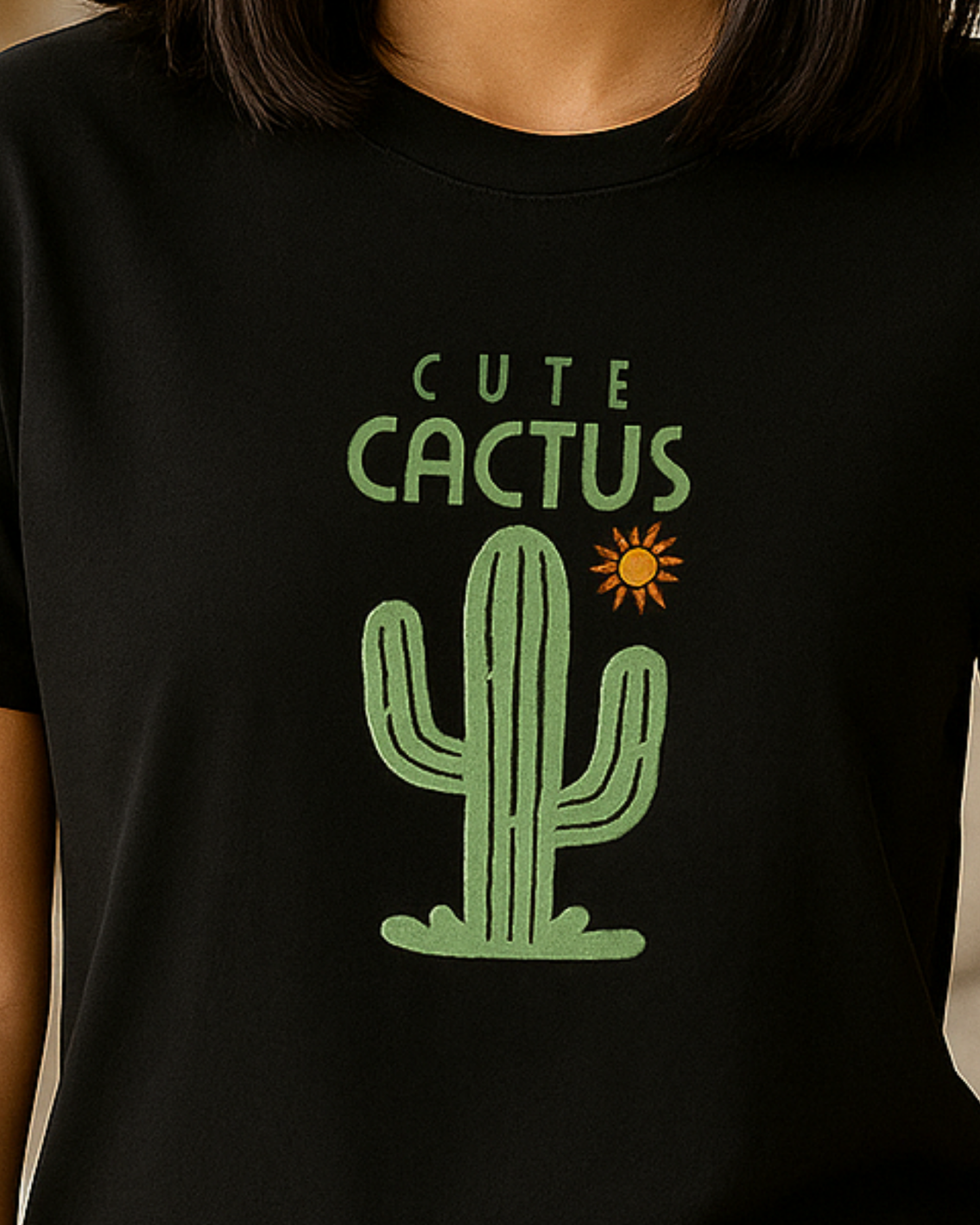 Black t-shirt with a green cactus graphic and 'Cute Cactus' text on a plain background