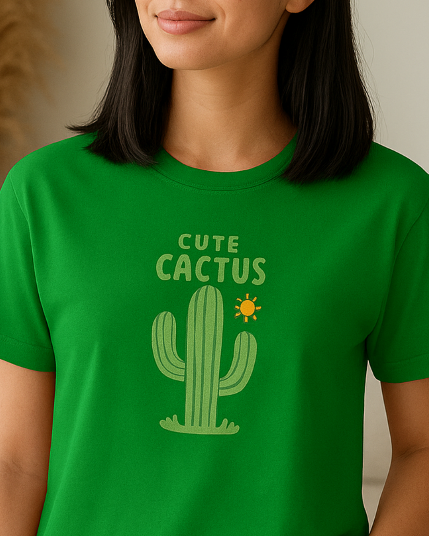 Person wearing a green t-shirt with a cactus graphic and 'Cute Cactus' text.