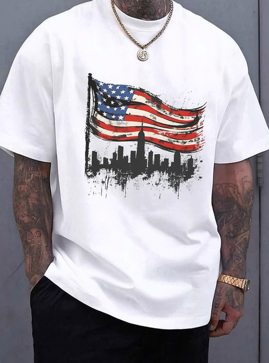 White oversized T-shirt featuring a bold American flag graphic with a New York City skyline design, modern streetwear style for men.