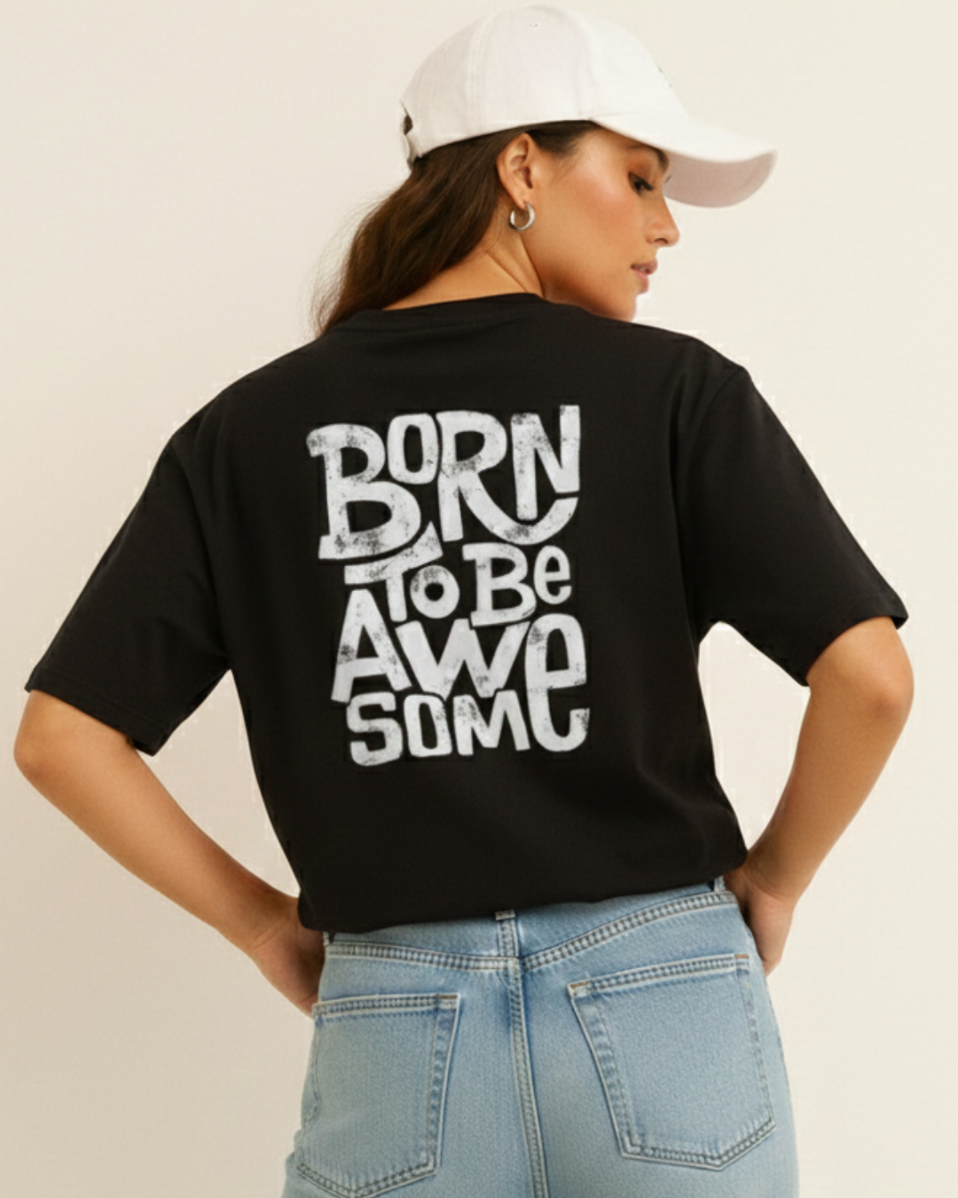 Person wearing a black t-shirt with 'Born to be Awesome' text on the back, standing against a plain background.