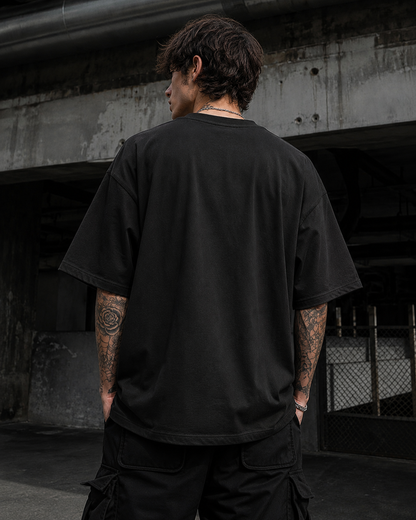 oversized black t-shirt with a bold red and white 'SHIT' graphic on the front, from white bear brand