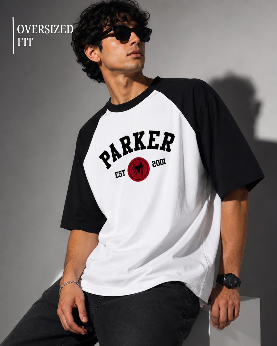 Black and white oversized raglan T-shirt for men and women featuring a premium 180 GSM cotton melange fabric, drop shoulder fit, half sleeves, and Parker graphic print by White Bear Clothing.