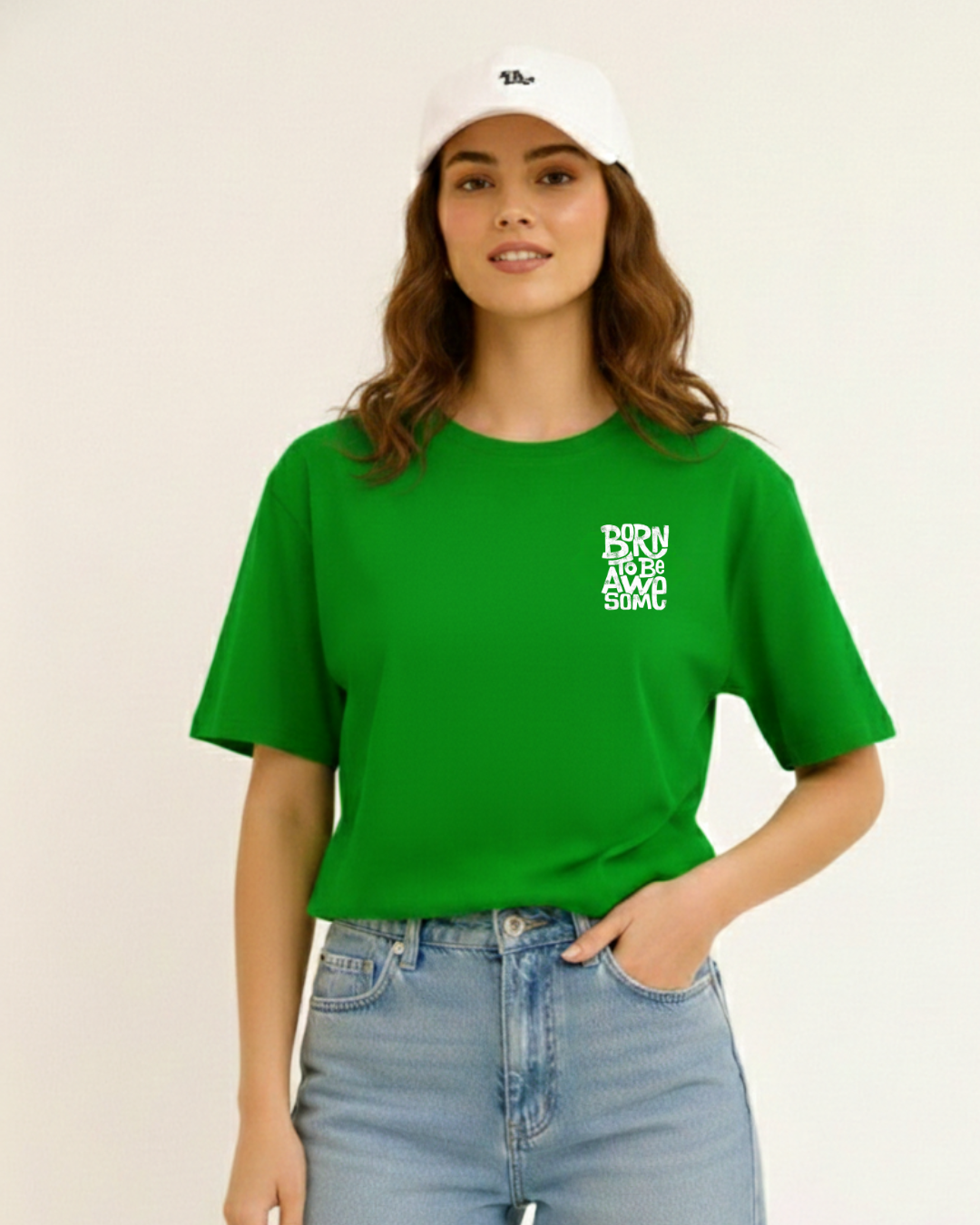 Person wearing a green t-shirt with text and a white cap on a beige background