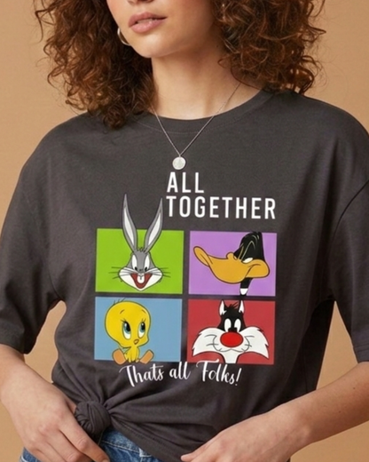 Person wearing a dark gray t-shirt with Looney Tunes characters and text.