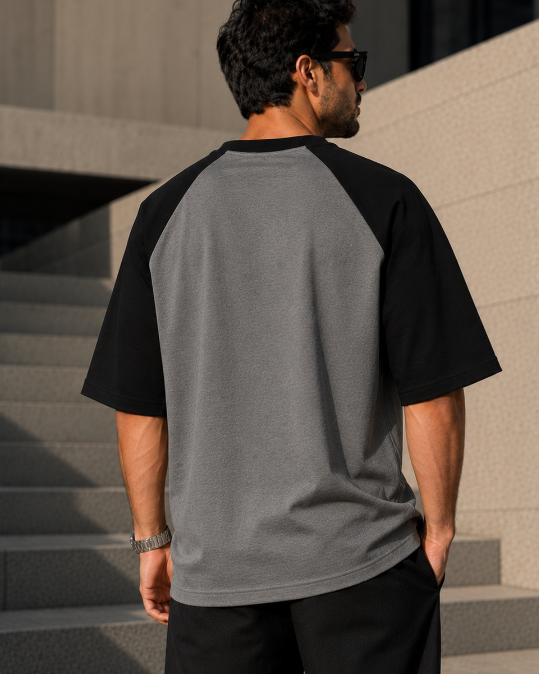 Men wearing oversized charcoal melange and black raglan T-shirt made from 100% cotton 180 GSM premium streetwear oversized fit from white bear brand