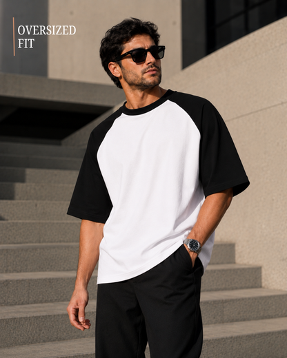 Men wearing oversized black and white raglan T-shirt made from 100% cotton 180 GSM premium streetwear oversized fit from white bear brand