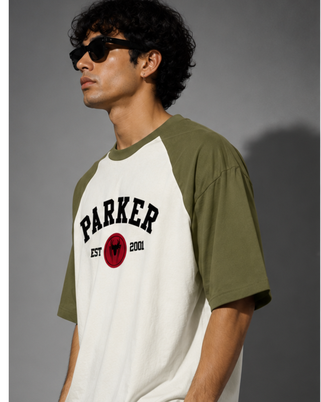 olive green and off white oversized raglan T-shirt for men and women featuring a premium 180 GSM cotton melange fabric, drop shoulder fit, half sleeves, and Parker graphic print by White Bear Clothing.
