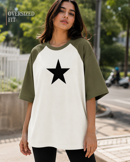 Female model wearing a black and white oversized raglan T-shirt with half sleeves and black star print