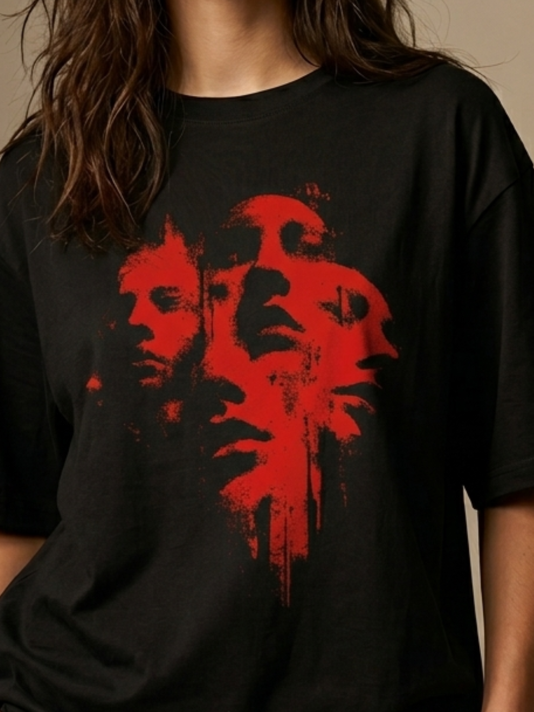 Black t-shirt with red abstract design worn by a person