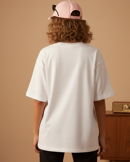 Oversized white women’s graphic t-shirt with Stay Unique illustration print, relaxed fit streetwear style