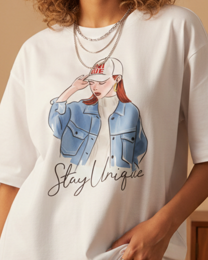 Oversized white women’s graphic t-shirt with Stay Unique illustration print, relaxed fit streetwear style