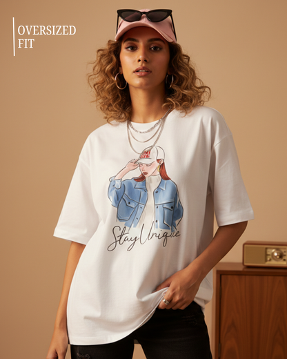Oversized white women’s graphic t-shirt with Stay Unique illustration print, relaxed fit streetwear style