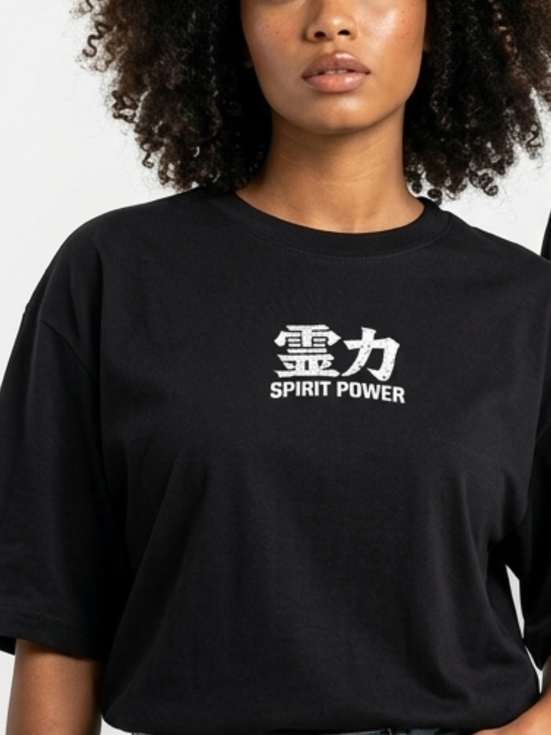 Oversized unisex black anime graphic T-shirt with Spirit Power front print and colorful Japanese anime character panels on the back, 240 GSM cotton streetwear tee worn by male and female models