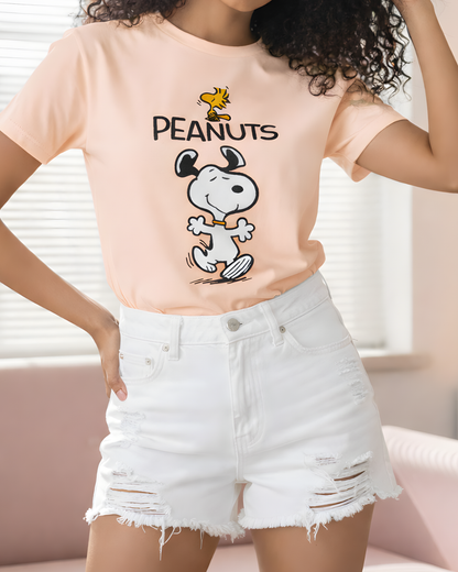 Person wearing a 'Peanuts' t-shirt with Snoopy and Woodstock graphic.