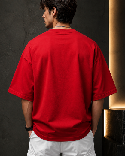 Premium red oversized men's t-shirt back view made from 260 GSM heavyweight terry cotton with dropped shoulders, relaxed fit, soft fabric, and minimalist streetwear style.