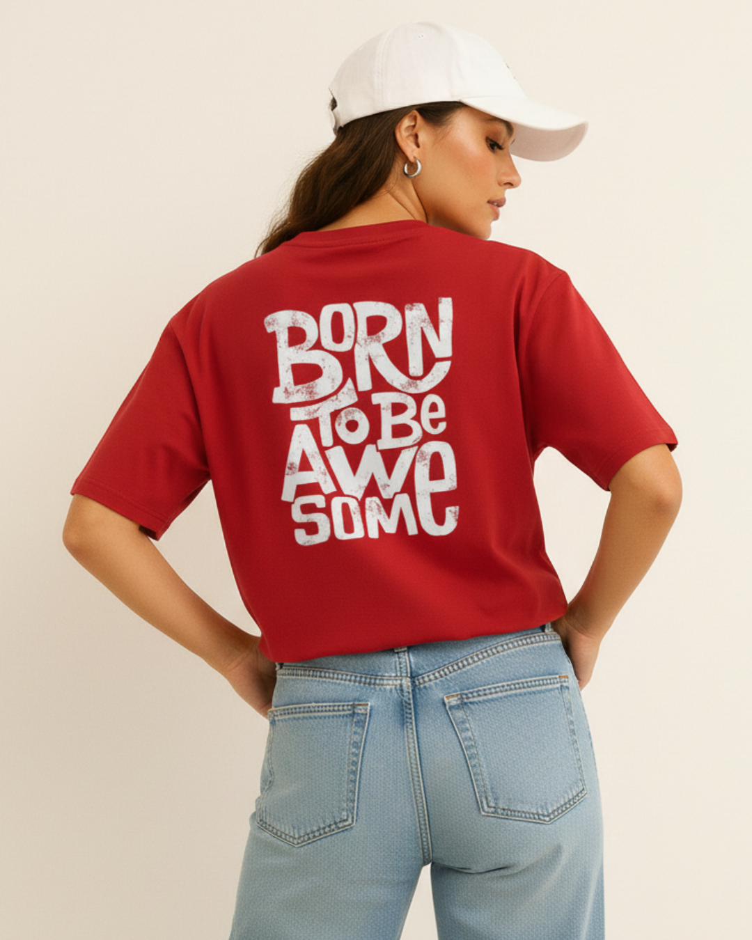 Person wearing a red t-shirt with 'Born to be Awesome' text on the back, standing against a plain background.