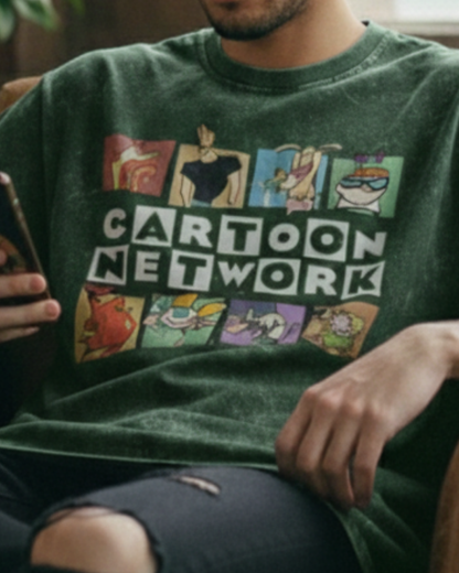 Person wearing a green 'Cartoon Network' t-shirt with colorful graphics.