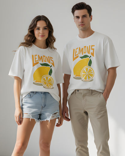 Two people wearing white t-shirts with lemon graphics and 'LEMONS' text on a plain background