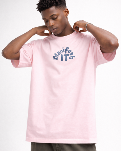 Person wearing a pink t-shirt with text on a white background