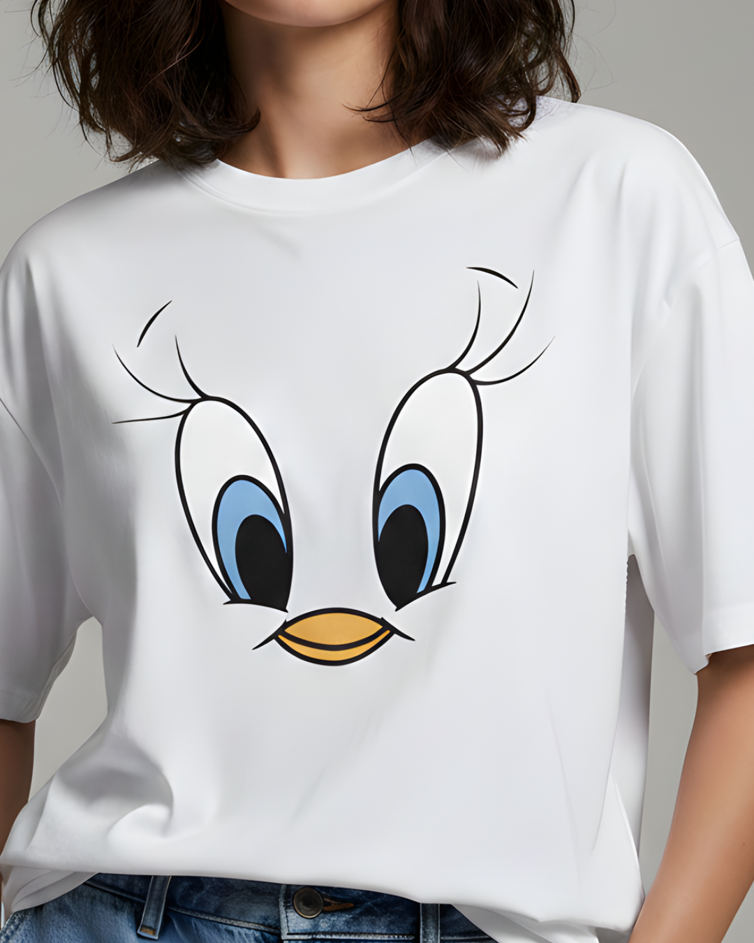 White t-shirt with a cartoon character face design on a plain background