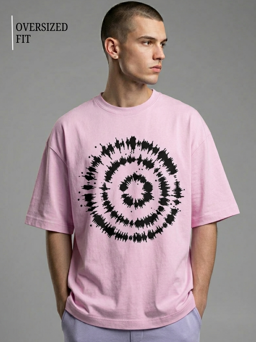 Man wearing a pink t-shirt with a black spiral design on a gray background