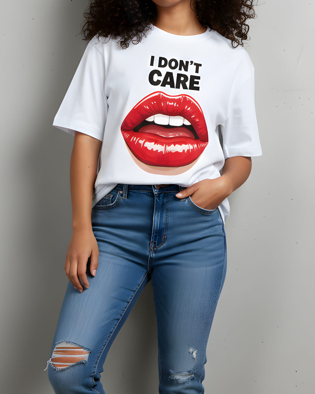 Person wearing a white t-shirt with red lips and 'I Don't Care' text, paired with blue jeans.