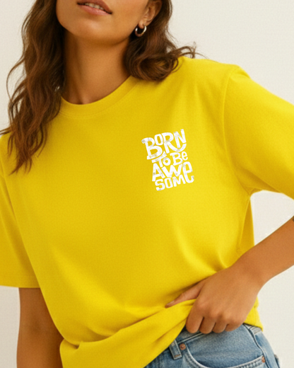 Person wearing a yellow t-shirt with 'Born to be Awesome' text.