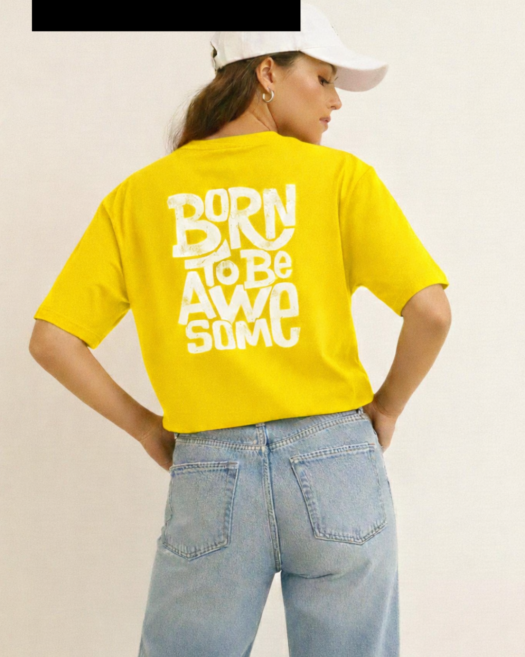 Person wearing a yellow t-shirt with 'Born to be Awesome' text on the back.